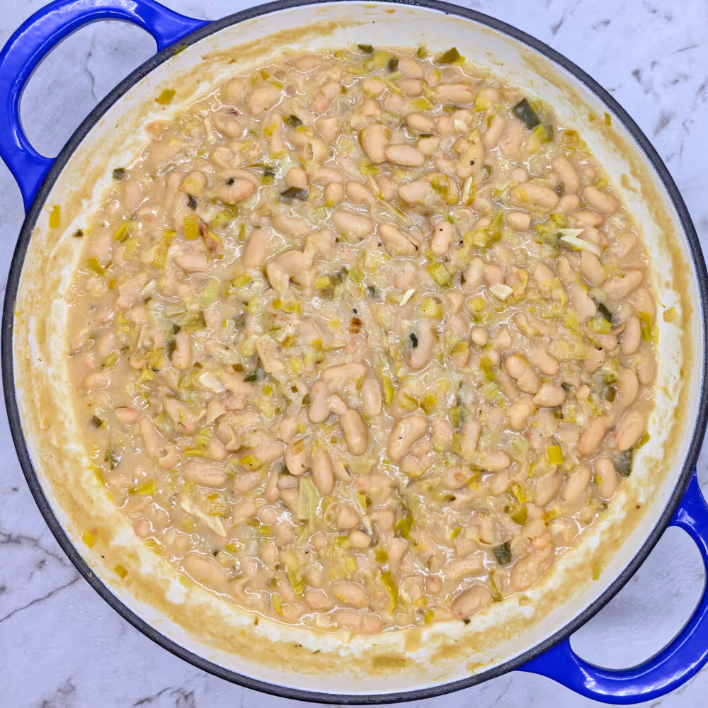  Perfectly cooked Leeky Beans. Simmered gently until thickened and the beans are soft, but not mushy.  